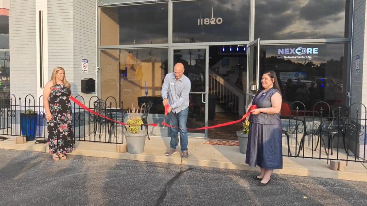 Ribbon cutting at the NexCore Coworking entrance, 11820 Tesson Ferry Road